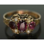 A George III 15ct gold ring set with two purple almandine garnets