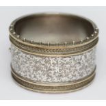 A Victorian bright cut engraved bangle, diam. approx. 5.5cm, unmarked, wt. 2oz.