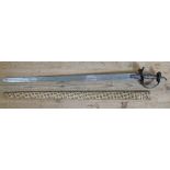 An Indian 18th/19th century sword, open work guard, double fullered blade and cloth bound wooden