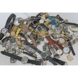 A tin containing approx 70 wristwatches, mixed gents and ladies, mechanical and quartz, including