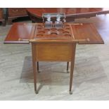 An Edwardian mahogany metamorphic drinks cabinet/table, inlaid with rosewood, boxwood and tulip,