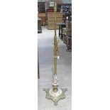 A late 19th century adjustable brass column standard lamp with stoneware and weight cast brass base.