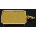 A Credit Suisse 999.9 fine gold pendant, in mount marked '750', gross wt. 11.07g.