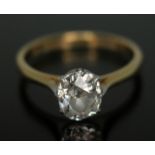 A diamond solitaire ring, the old oval/cushion cut stone weighing approx. 1.00 carats in eight
