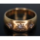 A hallmarked three stone diamond ring, gross wt. 2.07g, size K/L.