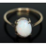 A precious opal cabochon ring, marked '9ct', gross wt. 1.94g.