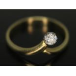 An 18ct diamond solitaire ring, the modern round brilliant cut diamond weighing approx. 0.10 carats,