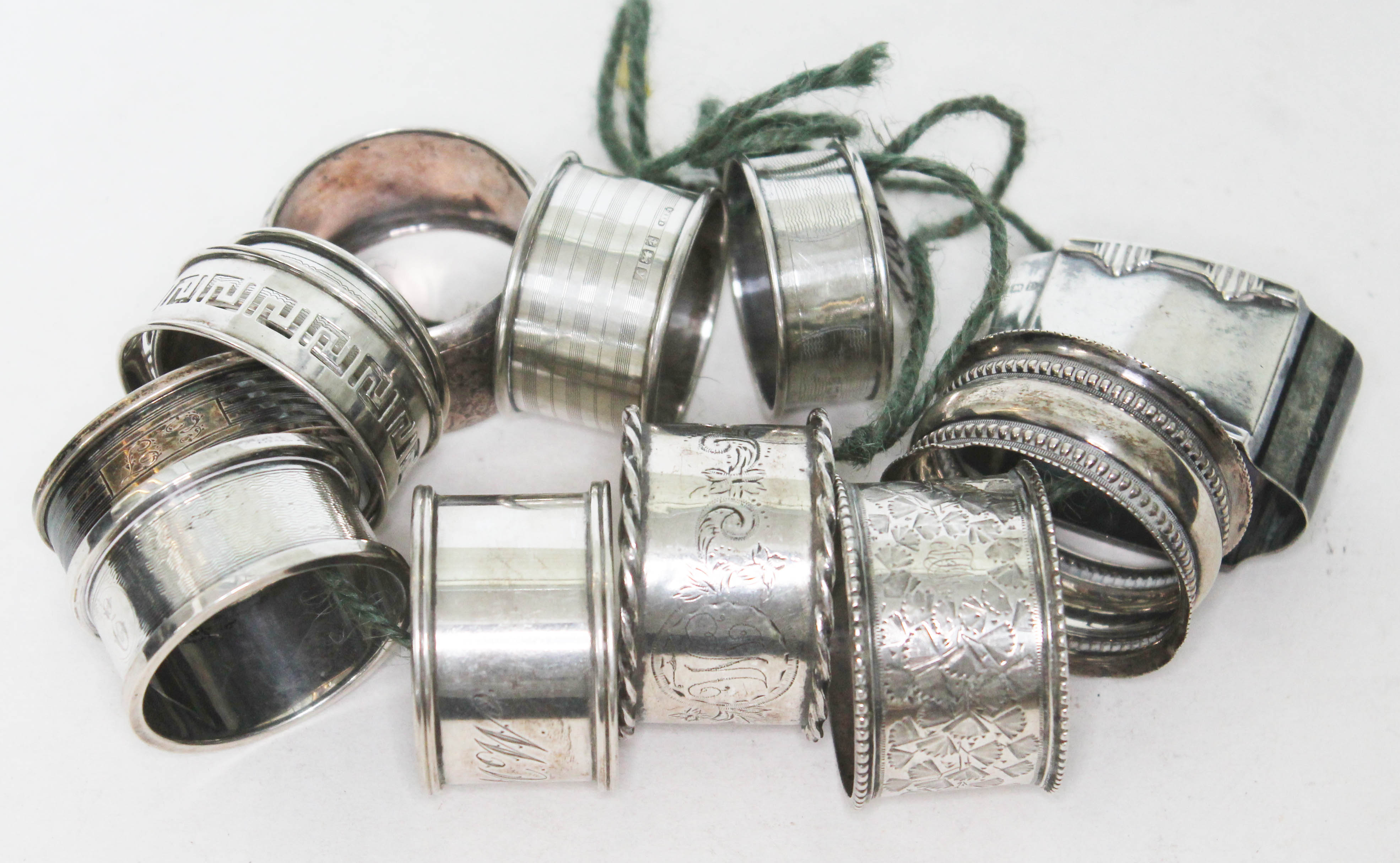 A group of 12 hallmarked silver serviette rings, wt. 7oz.