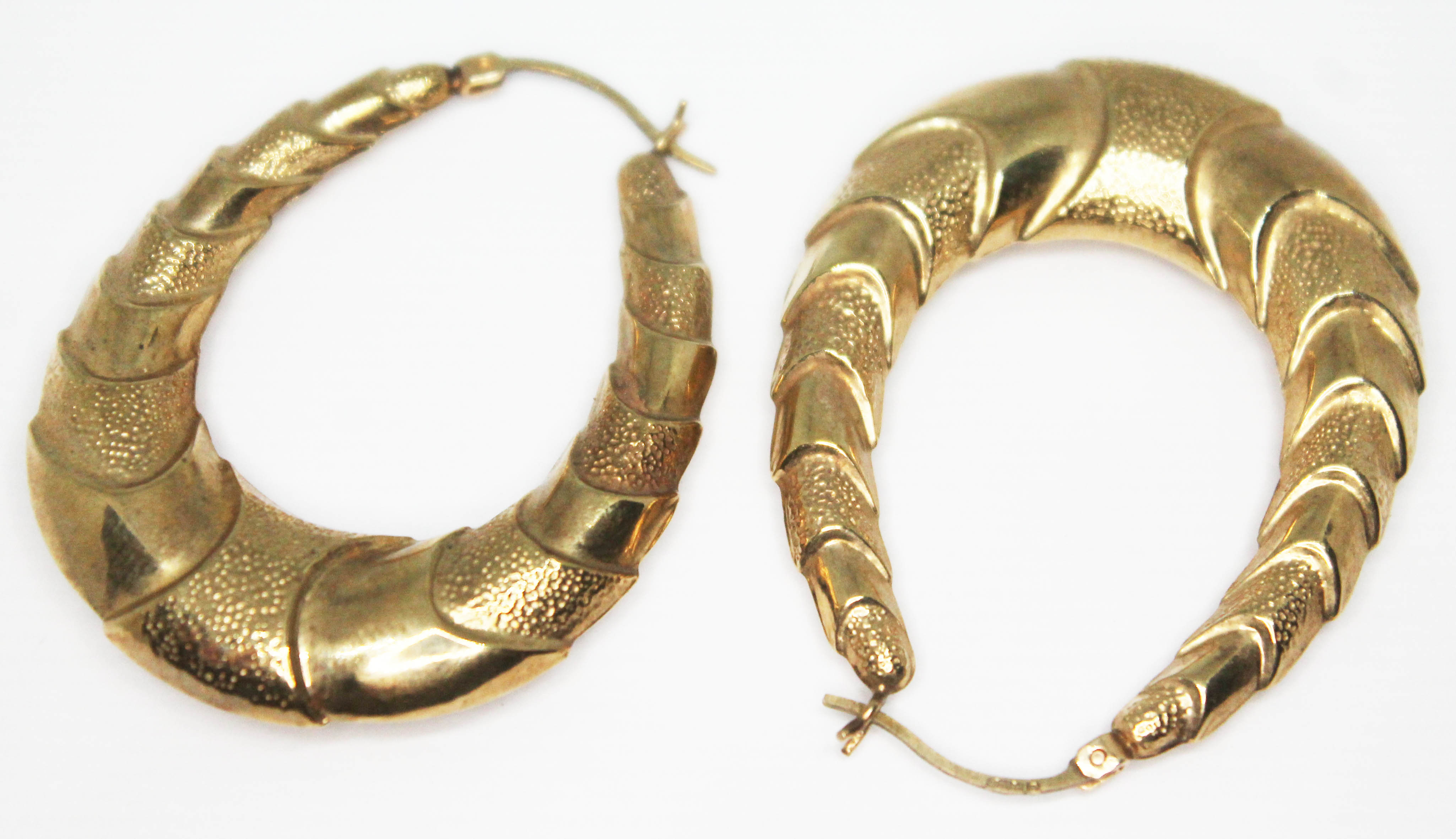 A pair of 9ct gold Pat Butcher style earrings, 9ct gold import marks, length 44mm, wt. 5.44g.