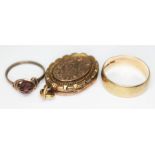 A mixed lot comprising a hallmarked 9ct gold wedding band, wt. 3.96g, a yellow metal wire ring and a