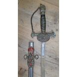 A Knights of Pythias ceremonial sword and scabbard, the guard monogrammed 'FCB', the etched blade