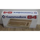 A Commodore 64 personal computer in original packaging.