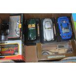 A box of 7 model cars in cluding Maisto and Burago. Vehicles include Plymouth Pronto Spyder, Ferrari