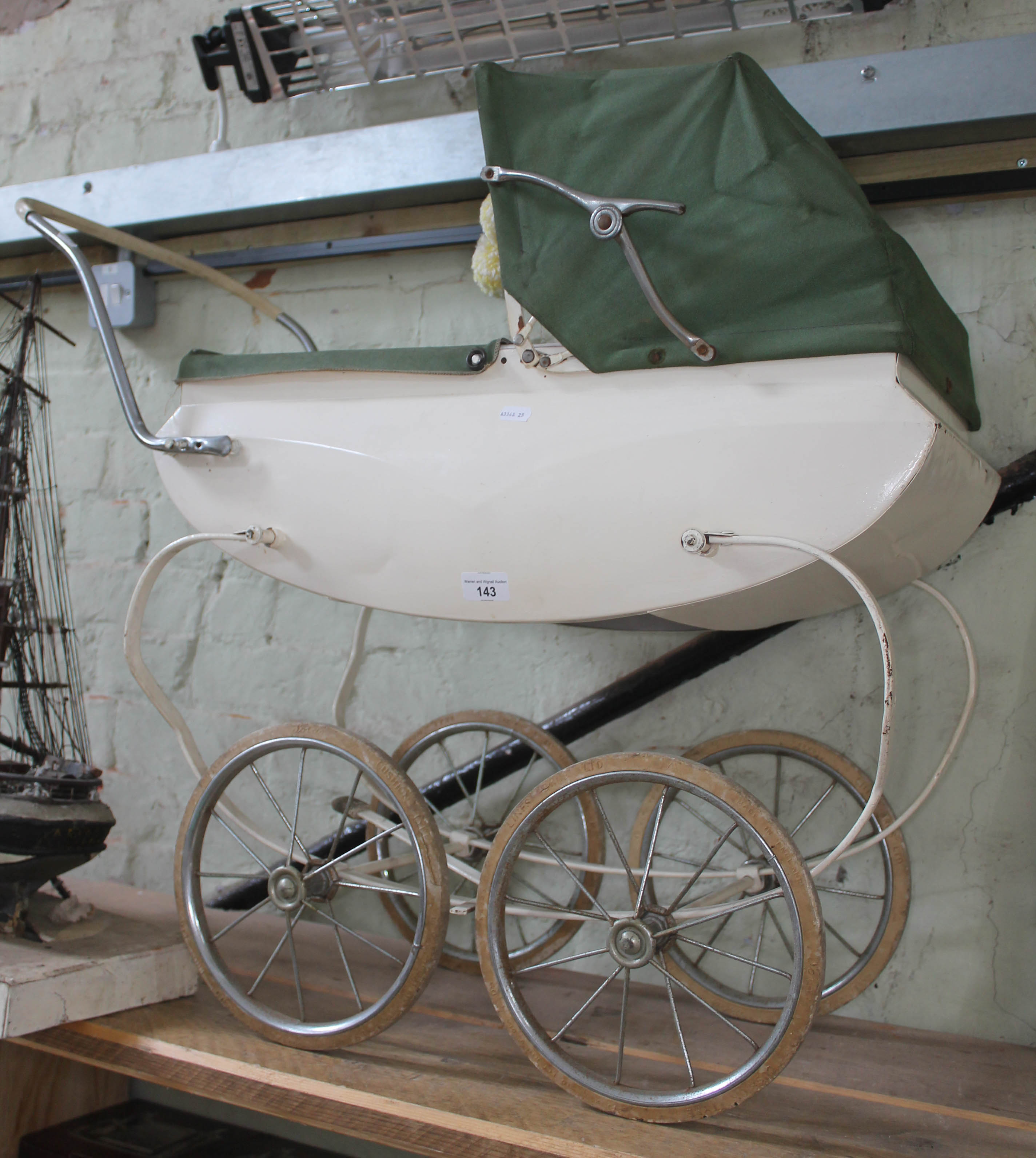 A vintage 1960s dolls pram.