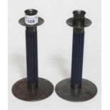 A pair of metal and blue painted wood candlesticks by Farg & Form (Sweden), height approx 8 inches.