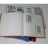 Four stamp albums including 2 Great Britain ,1 Gibraltar, and 1 mixed
