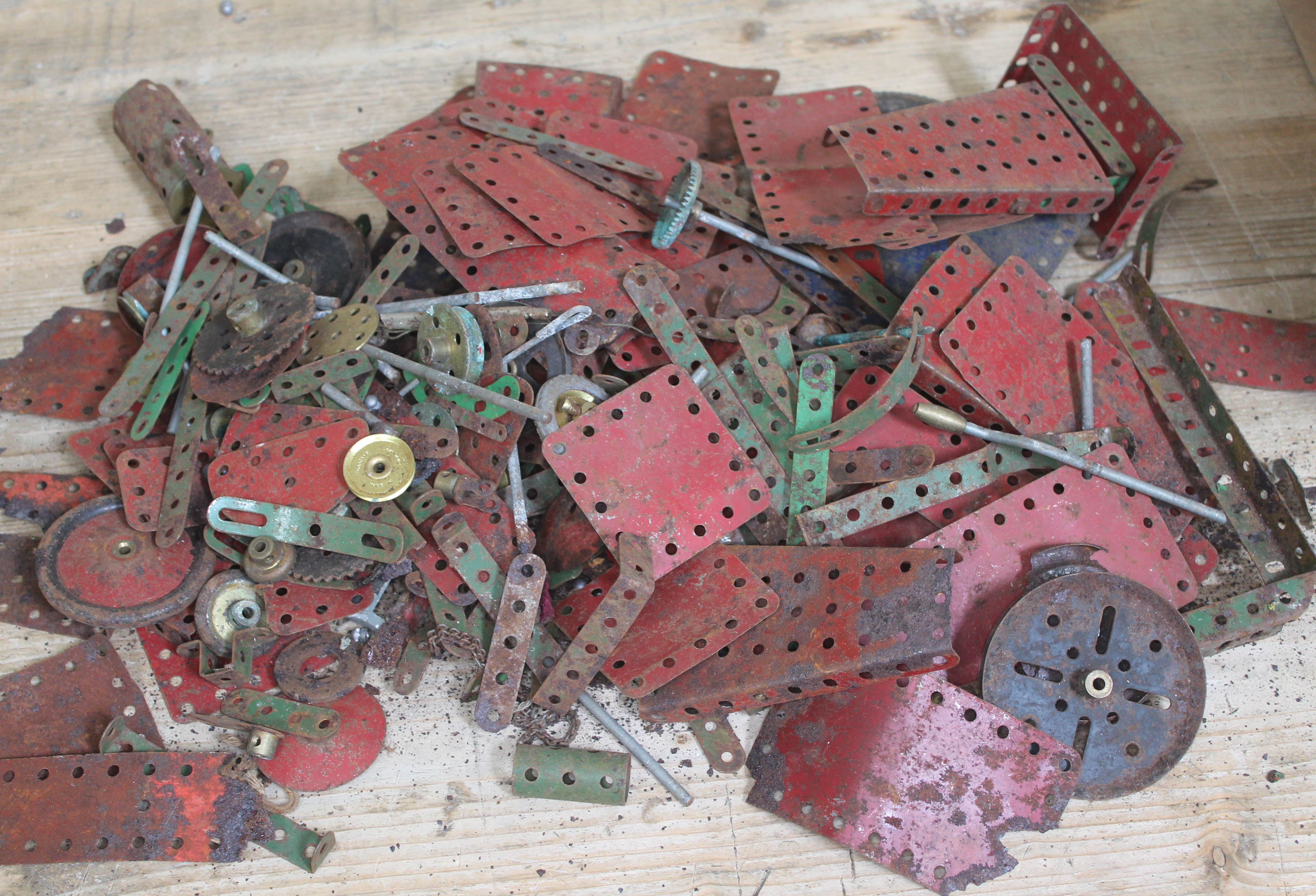 A box of rusty Meccano pieces.