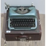 A vintage imperial typewriter with original case.