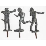 A group of three cast metal 'mascots' depicting sporting figures, length 11.5cm including screw.