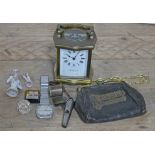 A mixed lot comprising a carriage clock, a pin cushion doll, a vintage stainless steel Accurist