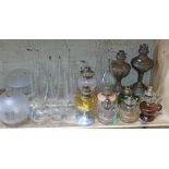 A quantity of oil lamps, shades and flues.