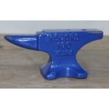 A blue painted Record 100 Years miniature anvil, length12.5cm.