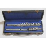A cased silver plated flute by F Buisson.
