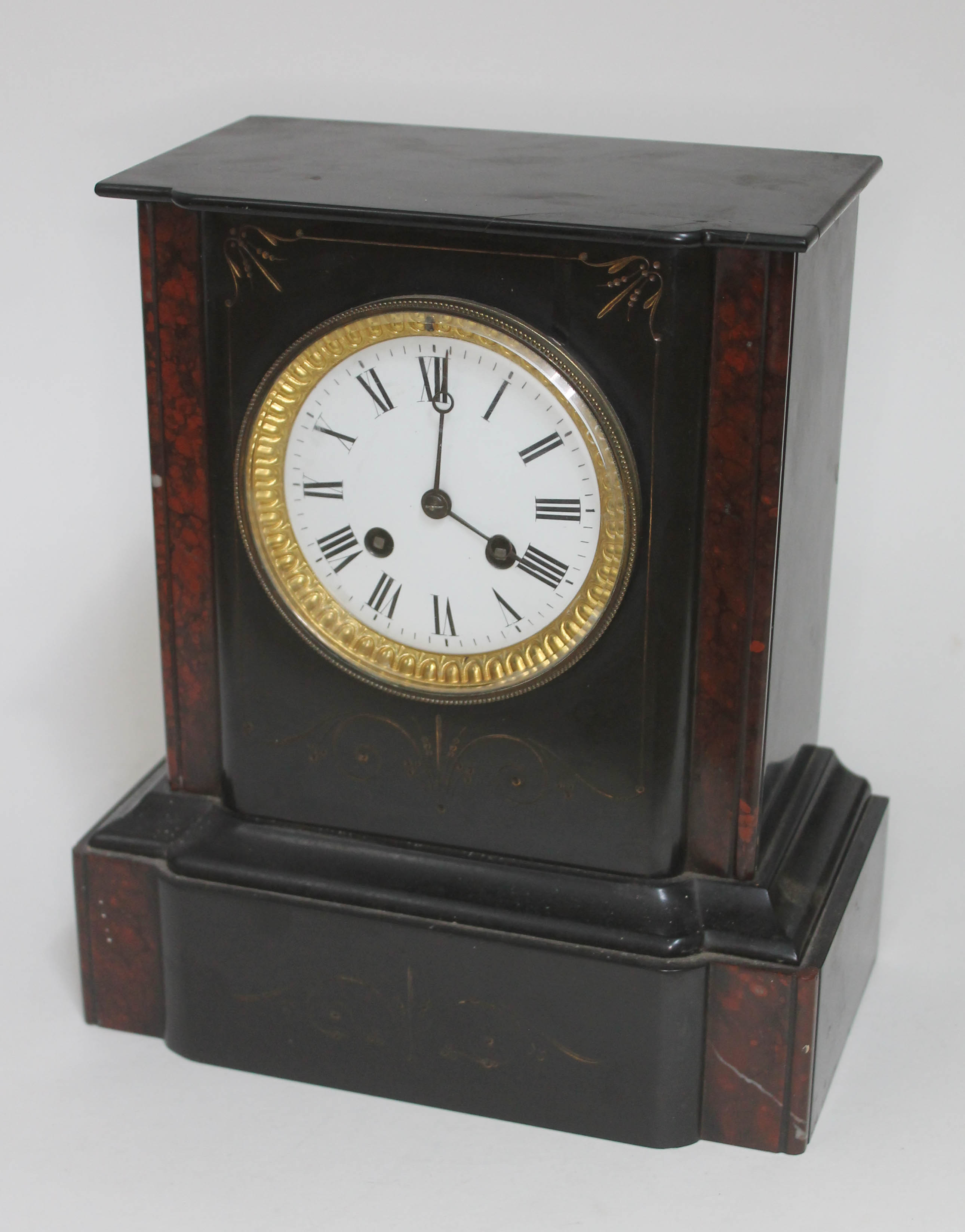A late 19th century black slate mantel clock, height 28cm.