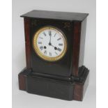 A late 19th century black slate mantel clock, height 28cm.