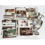 A Victorian silver plated ewer and quantity of postcards.