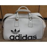 A vintage Addidas cream bag.