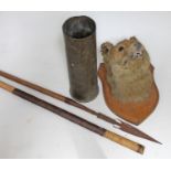 A mixed lot comprising a barbed spear (shaft cut), a brass shell case and a taxidermy fox head
