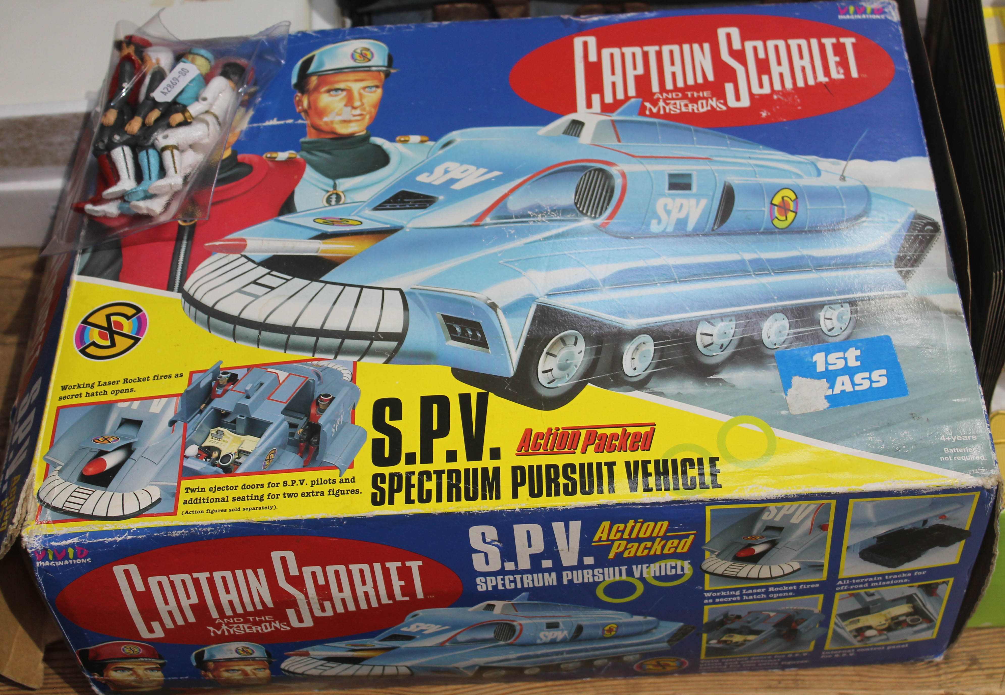 A Captain Scarlett boxed SPV and some figures.