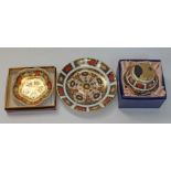 Three items of Royal Crown Derby comprising a saucer, a table lighter and a dish.