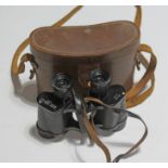 A pair of Watson Baker No. 2 MkI 6x30 binoculars with leather case.