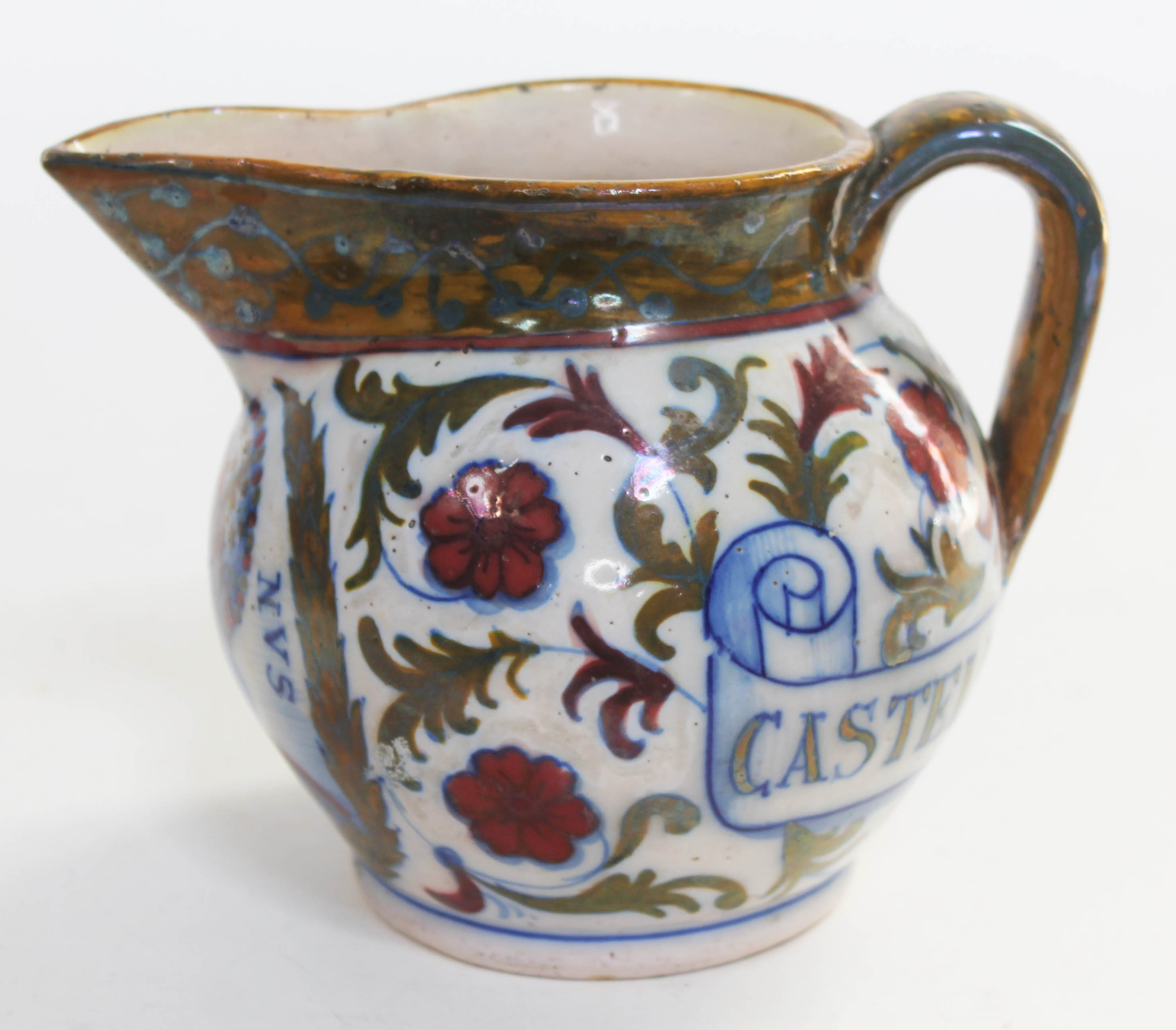 An Italian majolica jug entitled 'Castello De Cesari', length 19cm.