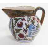 An Italian majolica jug entitled 'Castello De Cesari', length 19cm.