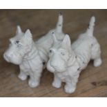 A pair of cast metal scottie dogs, length 7cm each.