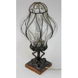 A metal bound glass lamp, height 41cm.