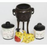 Four oriental items comprising two erotic scene scent bottles, a bronze incense burner and a