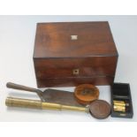 A Victorian walnut writing slope and contents comprising an Art Nouveau style brass crumb scoop, a