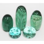 A group of four Victorian green glass dumps and one later, tallest 28cm.