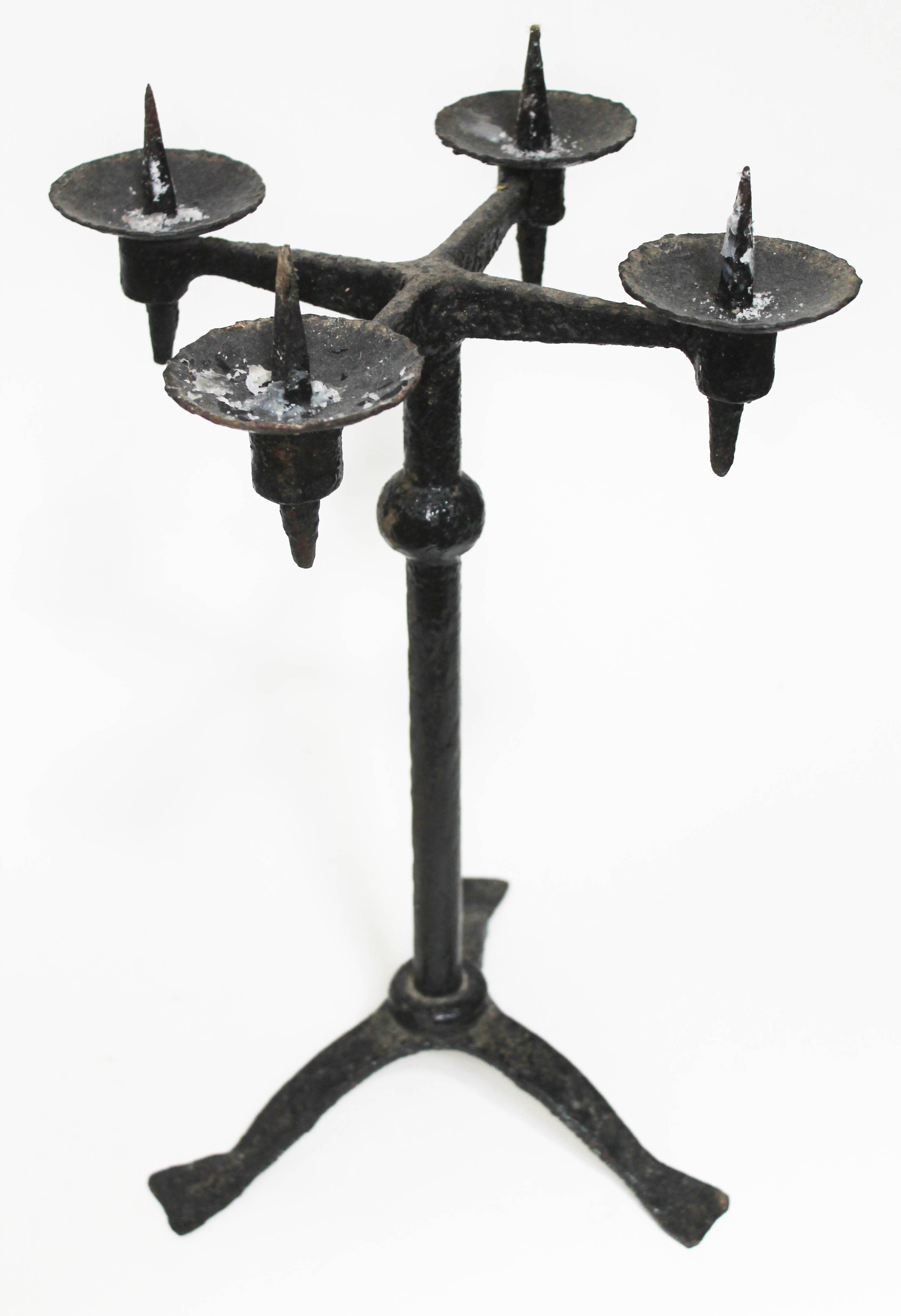 A wrought metal pricket candlestick, height 44cm.