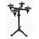 A wrought metal pricket candlestick, height 44cm.