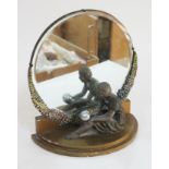 An Art Deco mirror with figure of a girl holding a ball, height 35.5cm.