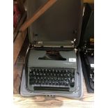 A vintage Olympia metal cased typewriter