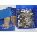 A box of coins and banknotes.