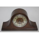 A domed oak mantel clock, length 42cm.