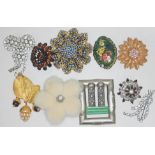 A mixed lot of vintage costume jewellery including an Ivana brooch, a mink brooch, a belt buckle