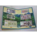 An album of world banknotes.